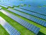 Solar panels producing green renewable energy. Solar power station in the field with green grass.