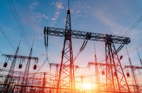 High-voltage power lines. Electricity distribution station. high voltage electric transmission tower. Distribution electric substation with power lines and transformers